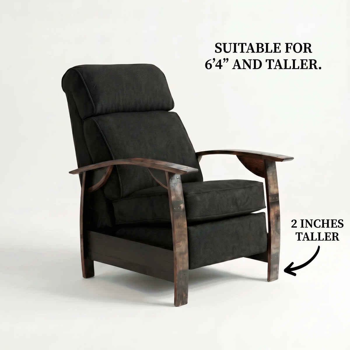 Extra Tall whiskey barrel recliner chair in black plush fabric with oak whiskey-barrel stave armrests, upright, on a white background, labelled suitable for 6'4" and taller with legs 2 inches taller