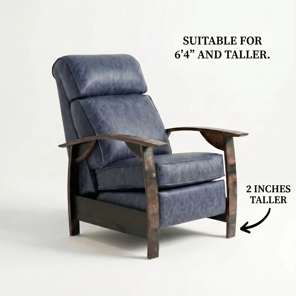 Extra Tall whiskey barrel recliner chair in denim blue distressed leather with oak whiskey-barrel stave armrests, upright, on a white background, labelled suitable for 6'4" and taller with legs 2 inches taller