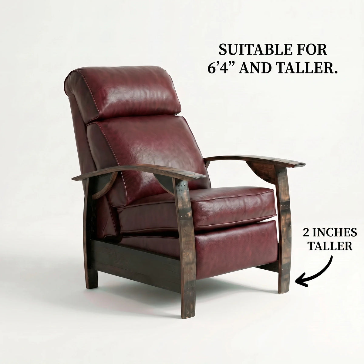 Extra Tall whiskey barrel recliner chair in deep oxblood burgundy leather with oak whiskey-barrel stave armrests, upright, on a white background, labelled suitable for 6'4" and taller with legs 2 inches taller
