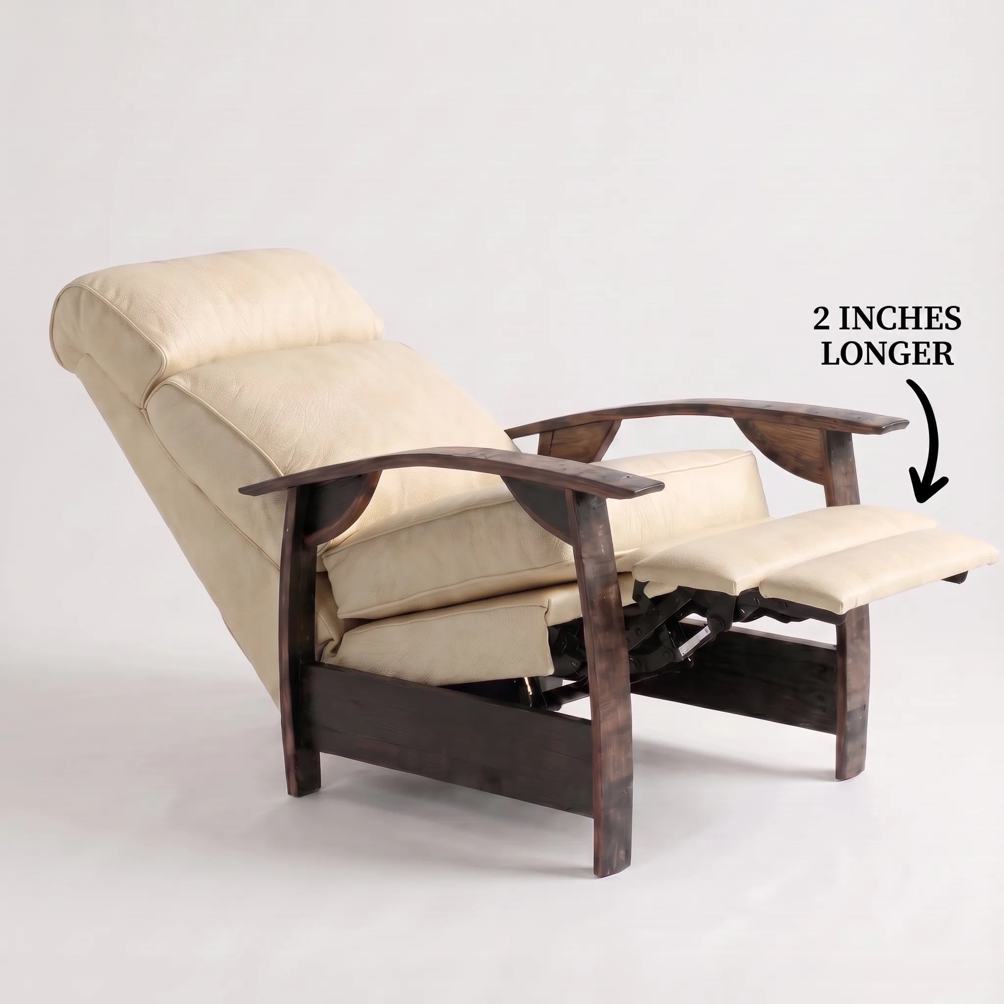 Big & Tall cream ivory leather whiskey barrel recliner reclined with the 2-inch-longer footrest extended and oak whiskey-barrel stave armrests, on a white background