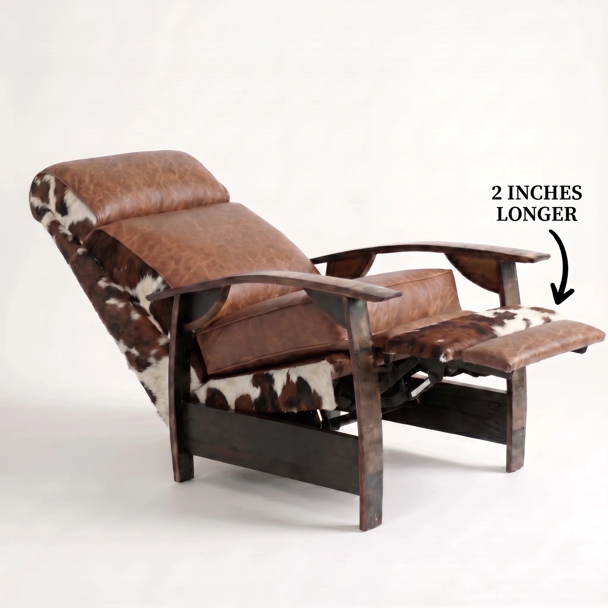 Big & Tall tri-color cowhide whiskey barrel recliner reclined with the 2-inch-longer footrest extended and oak whiskey-barrel stave armrests, on a white background