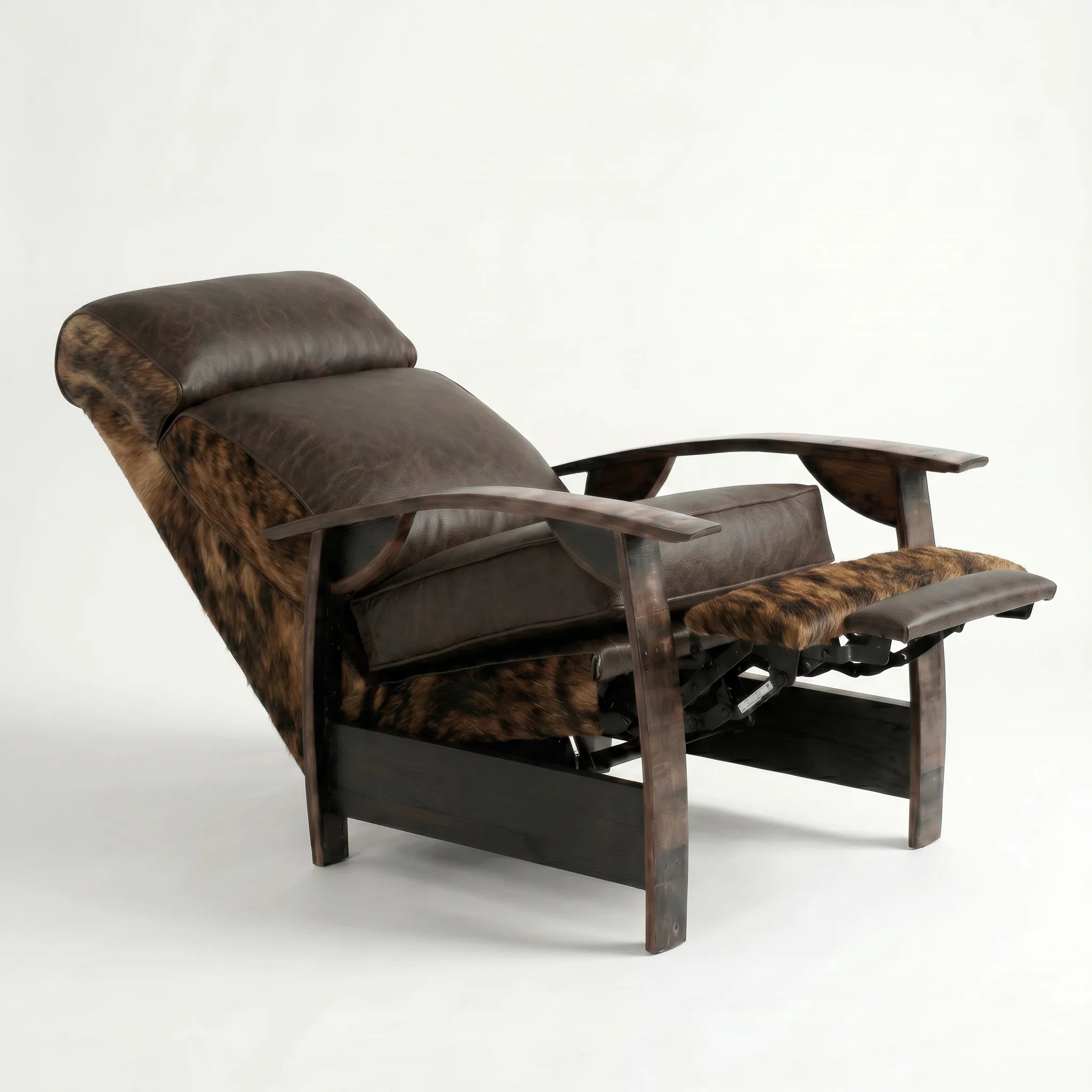 Brindle cowhide whiskey barrel recliner reclined with footrest extended and oak whiskey-barrel stave armrests, on a white background