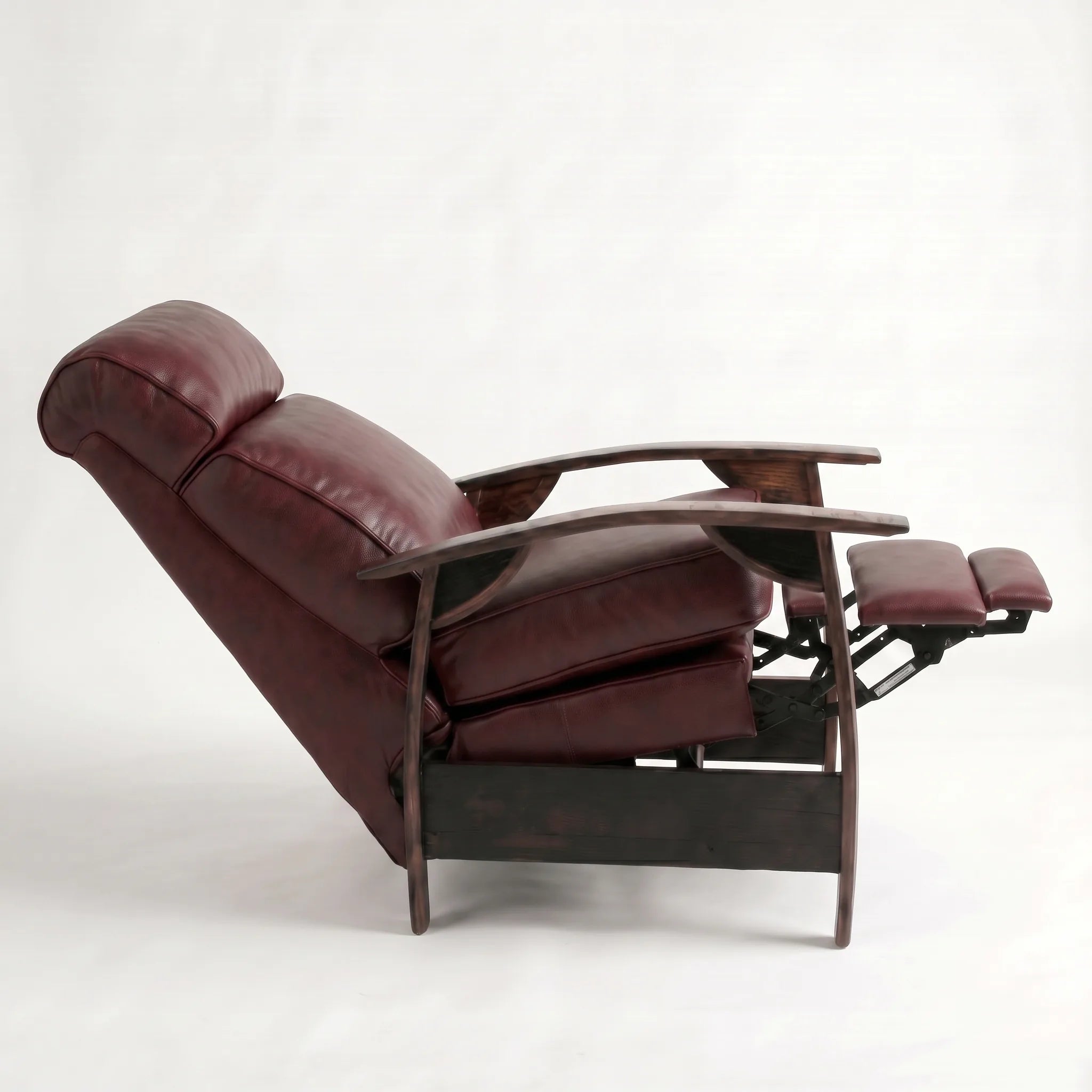Side view of the Big & Tall oxblood leather whiskey barrel recliner fully reclined, on a white background