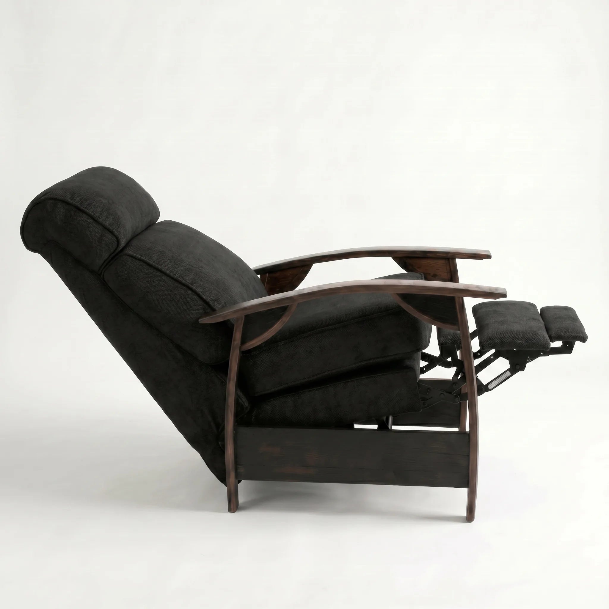 Side view of the black plush fabric whiskey barrel recliner fully reclined, on a white background