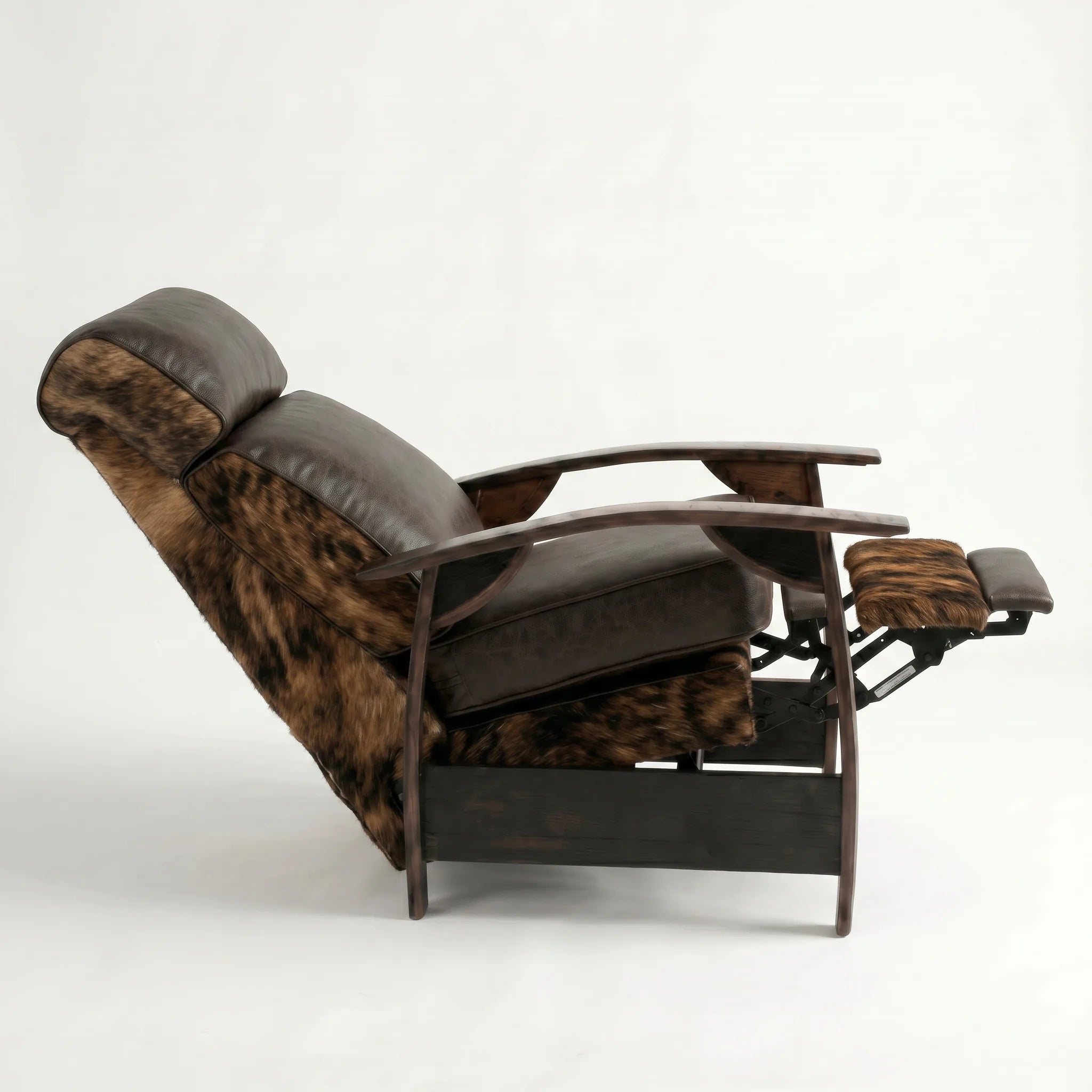 Side view of the brindle cowhide whiskey barrel recliner fully reclined, on a white background