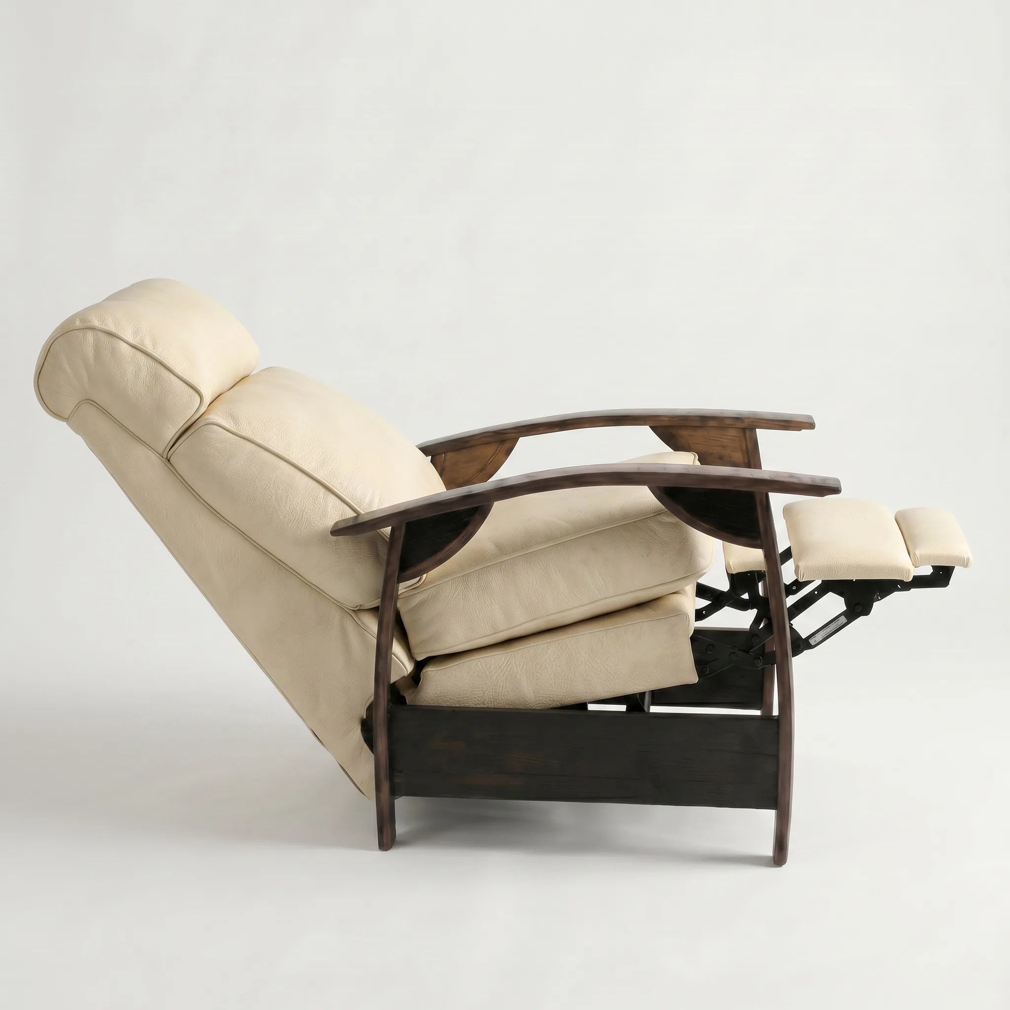 Side view of the cream ivory leather whiskey barrel recliner fully reclined, on a white background