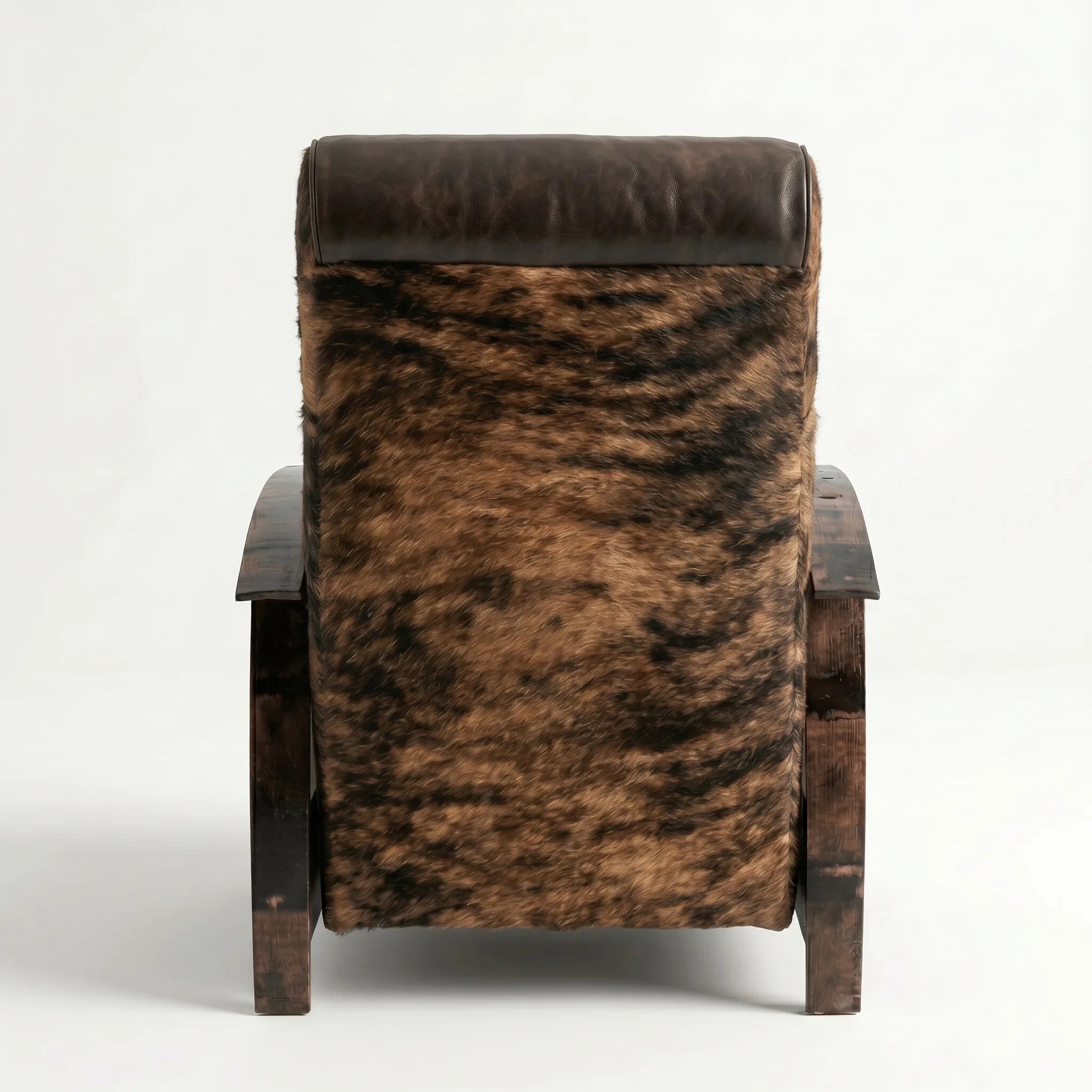 Rear view of the brindle cowhide whiskey barrel recliner showing the back panel, on a white background