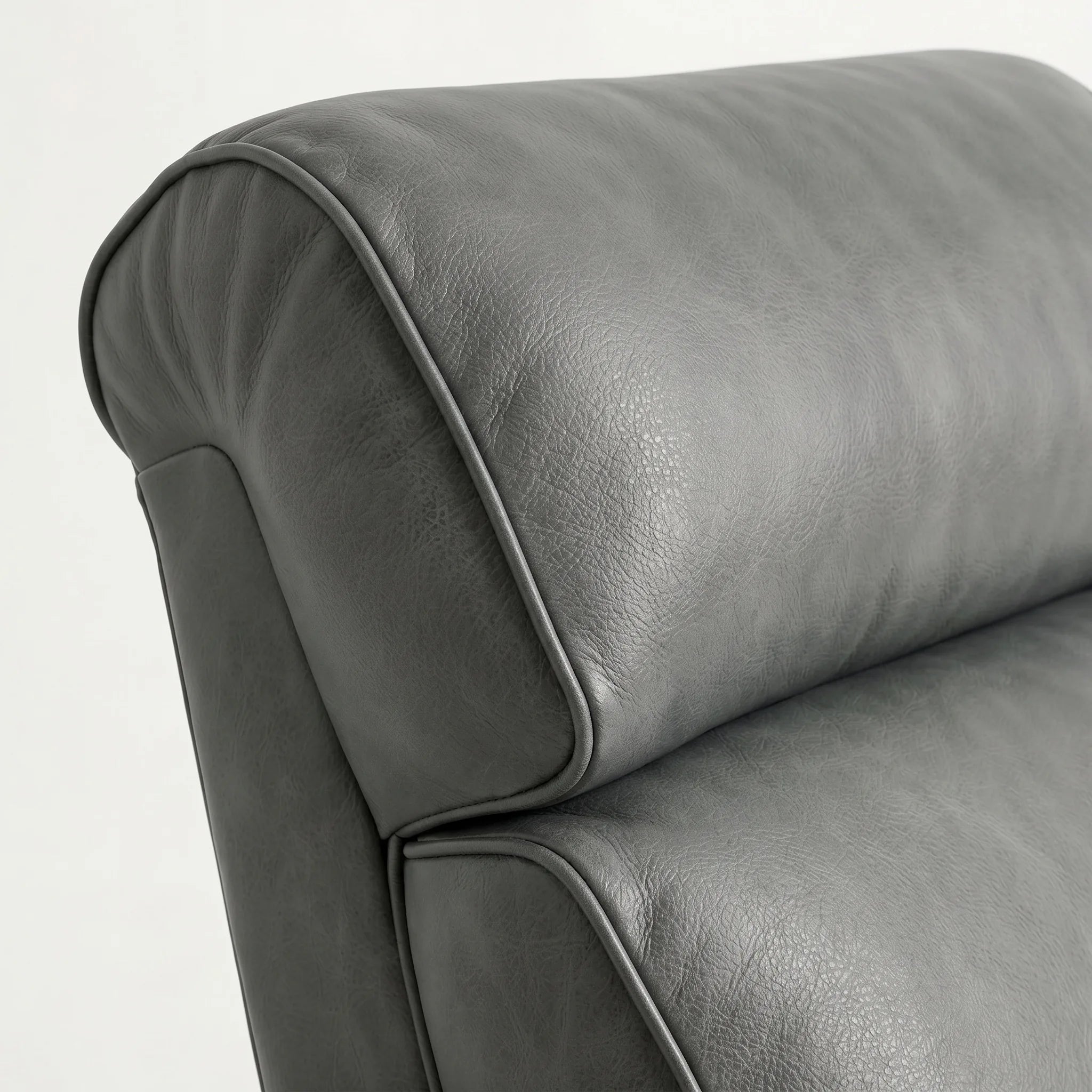 Close-up of the Big & Tall slate gray leather whiskey barrel recliner headrest and cushion, on a white background