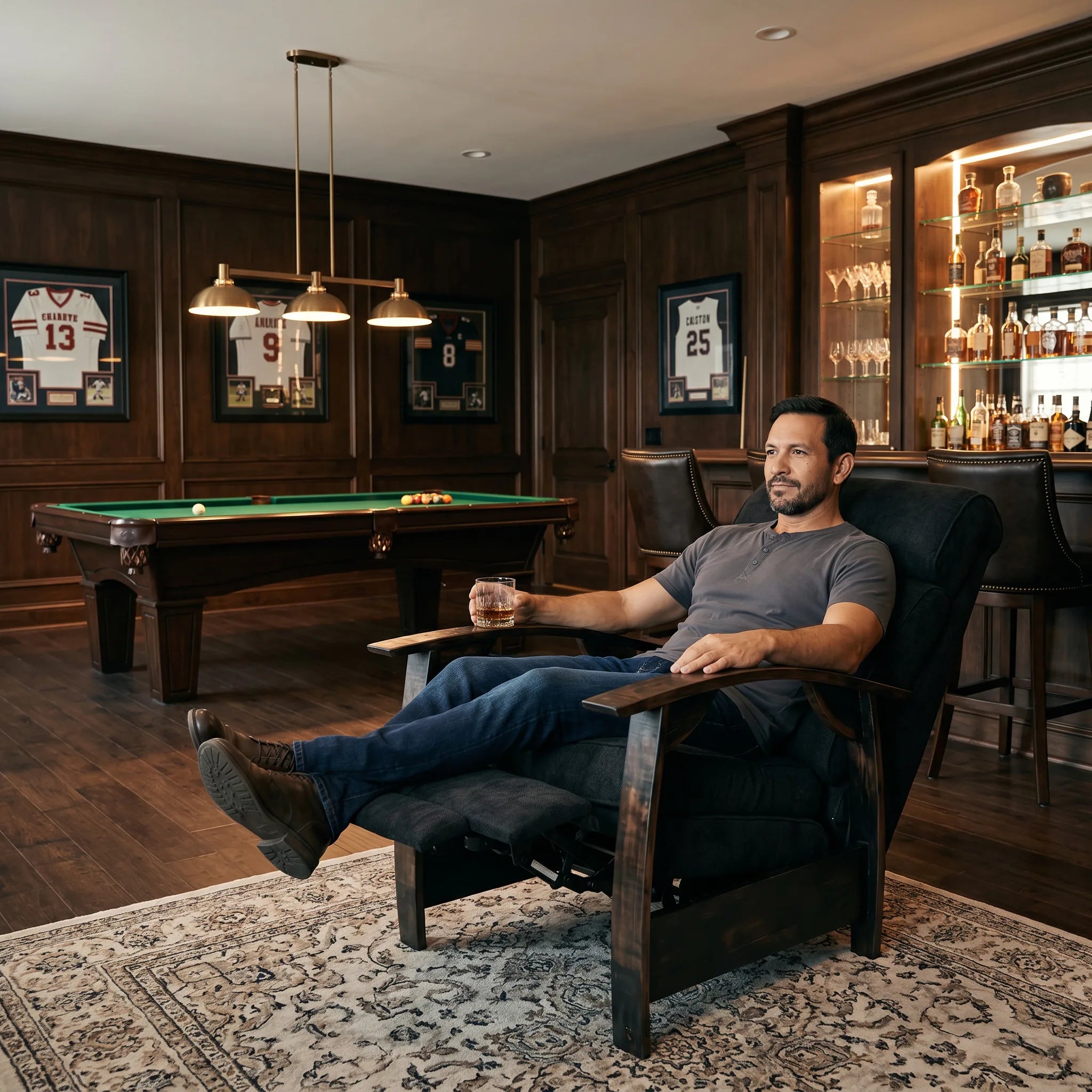 Man relaxing in a black plush fabric whiskey barrel recliner in a games room man cave