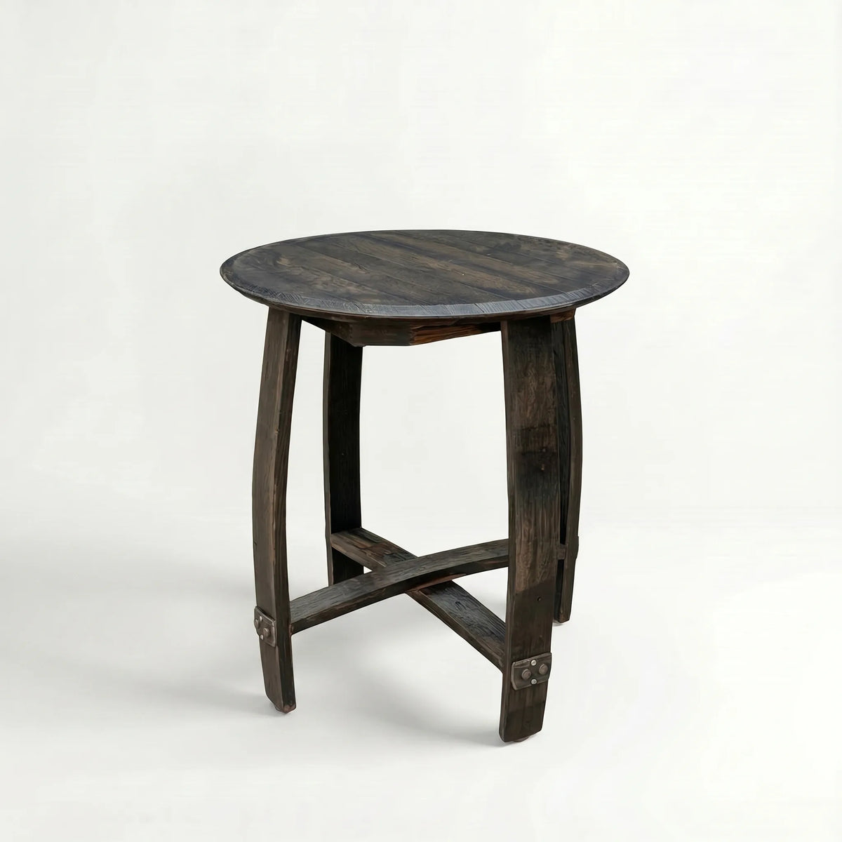 Round wooden side table made out of a whiskey barrel on a white background