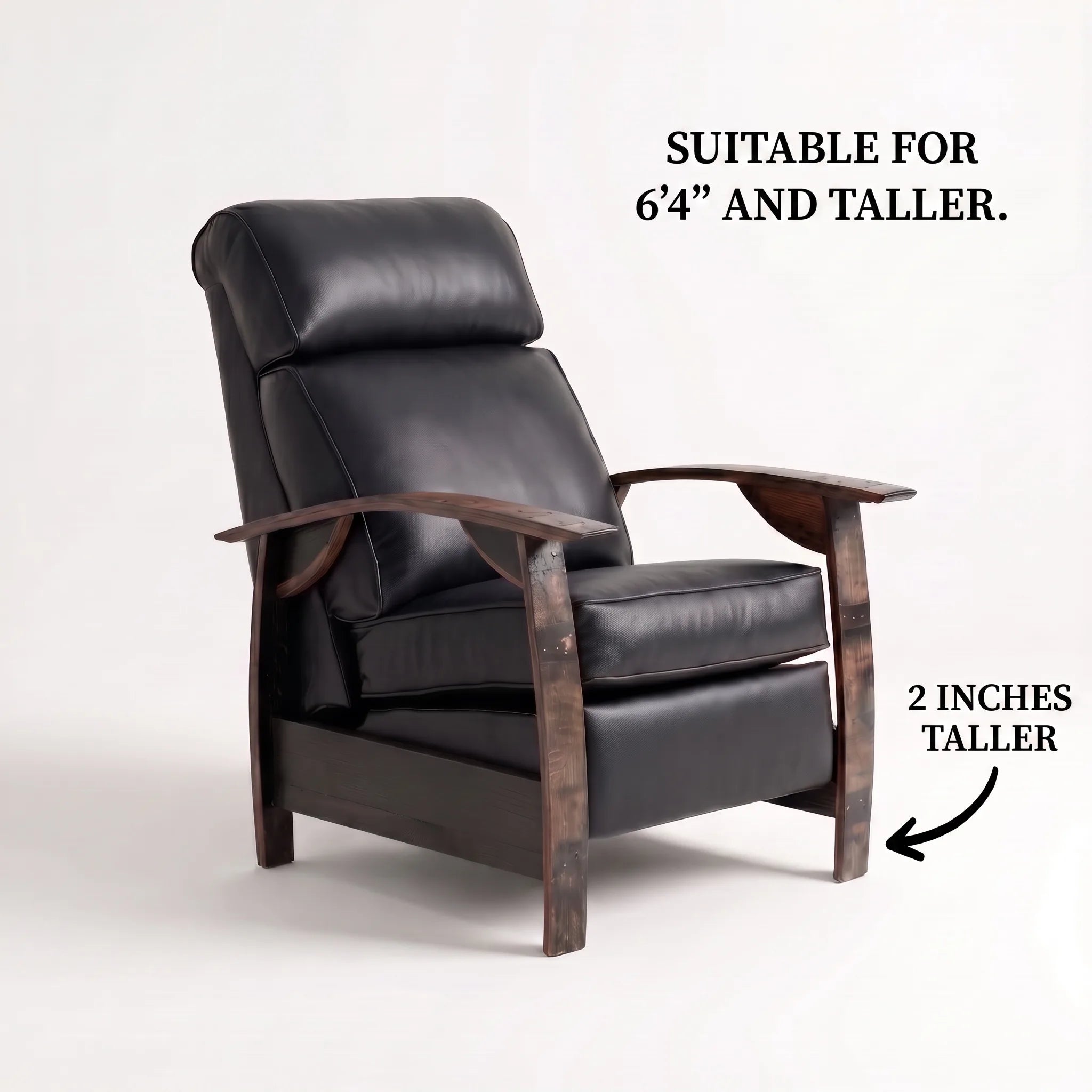 Big & Tall whiskey barrel recliner chair in smooth black full-grain leather with oak whiskey-barrel stave armrests, upright, on a white background, labelled suitable for 6'4" and taller with legs 2 inches taller