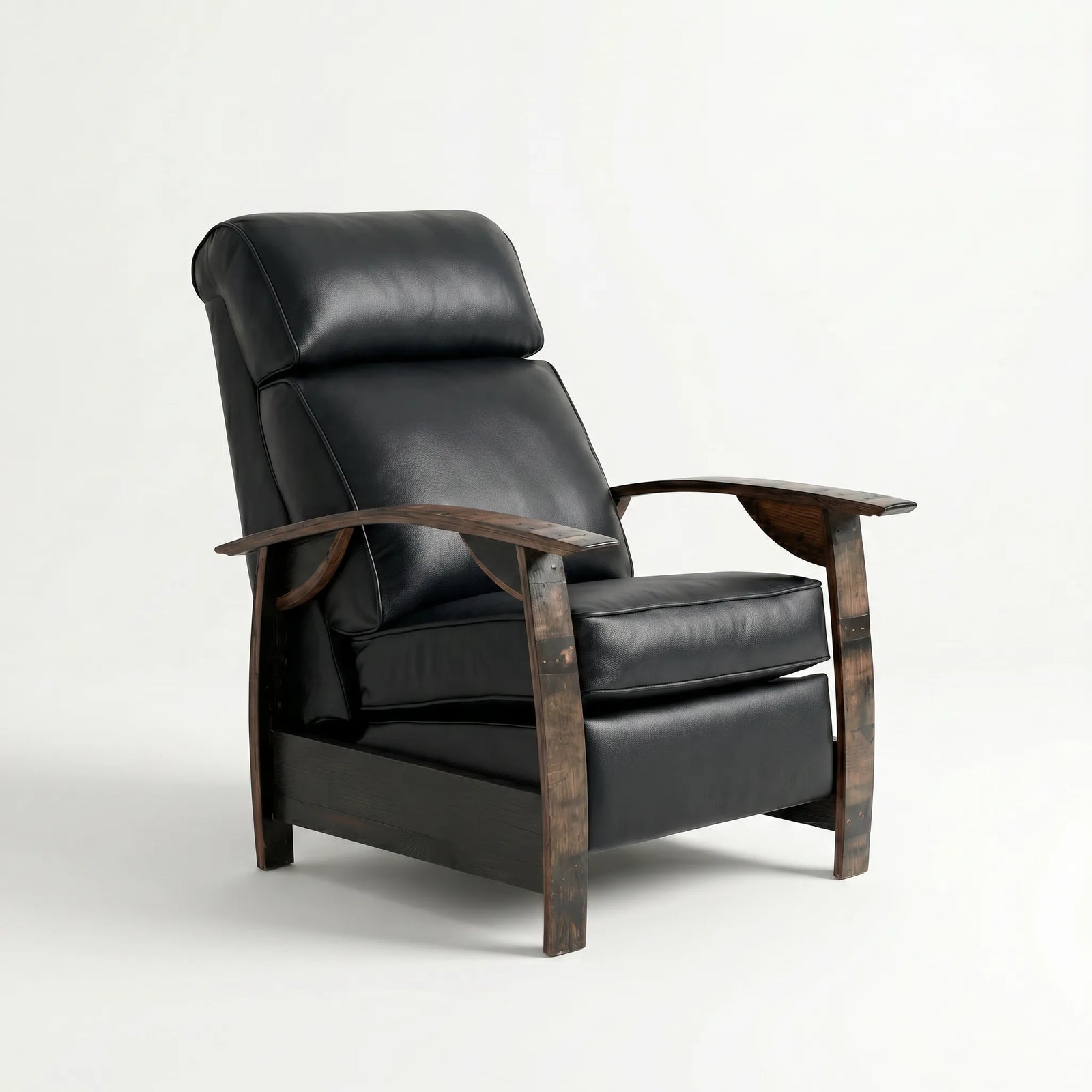 Whiskey barrel recliner chair in smooth black full-grain leather with oak whiskey-barrel stave armrests, upright, on a white background