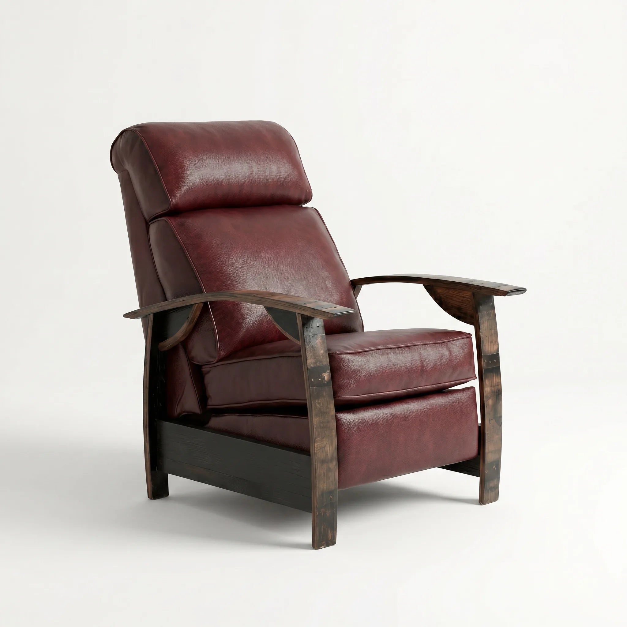 Whiskey barrel recliner chair in deep oxblood burgundy leather with oak whiskey-barrel stave armrests, upright, on a white background