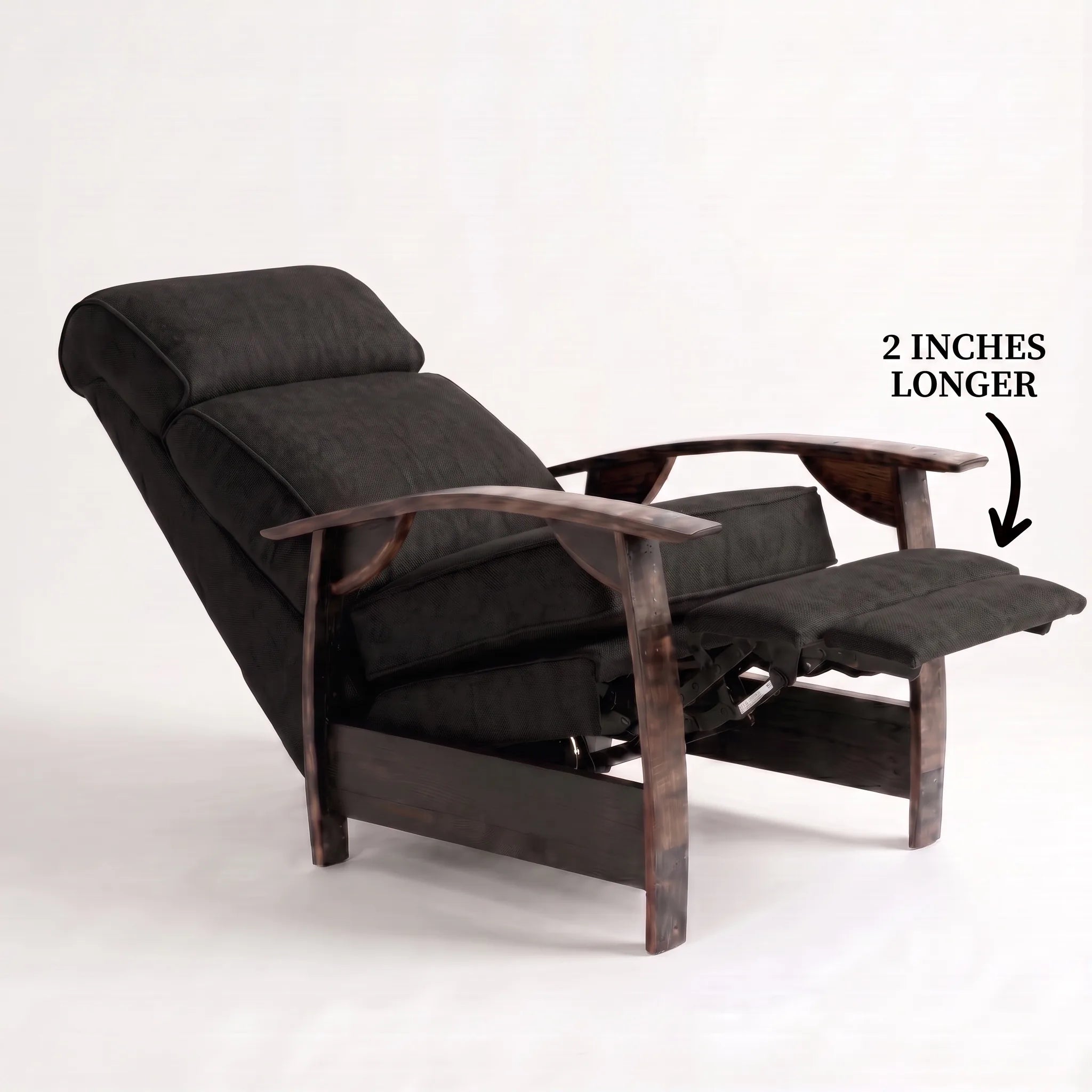 Big & Tall black plush fabric whiskey barrel recliner reclined with the 2-inch-longer footrest extended and oak whiskey-barrel stave armrests, on a white background