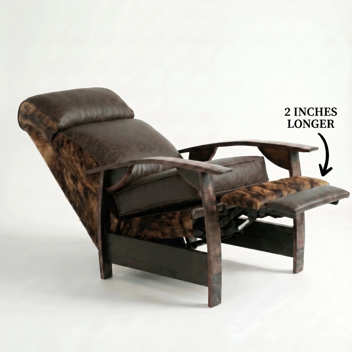 Extra Tall brindle cowhide whiskey barrel recliner reclined with the 2-inch-longer footrest extended and oak whiskey-barrel stave armrests, on a white background