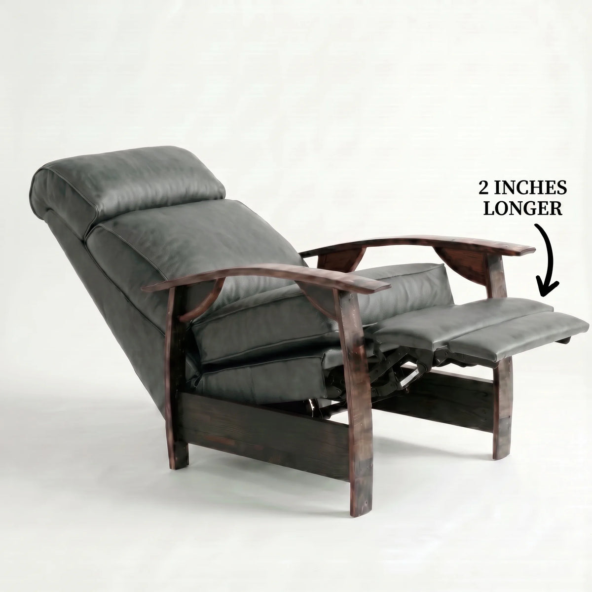 Extra Tall slate gray leather whiskey barrel recliner reclined with the 2-inch-longer footrest extended and oak whiskey-barrel stave armrests, on a white background