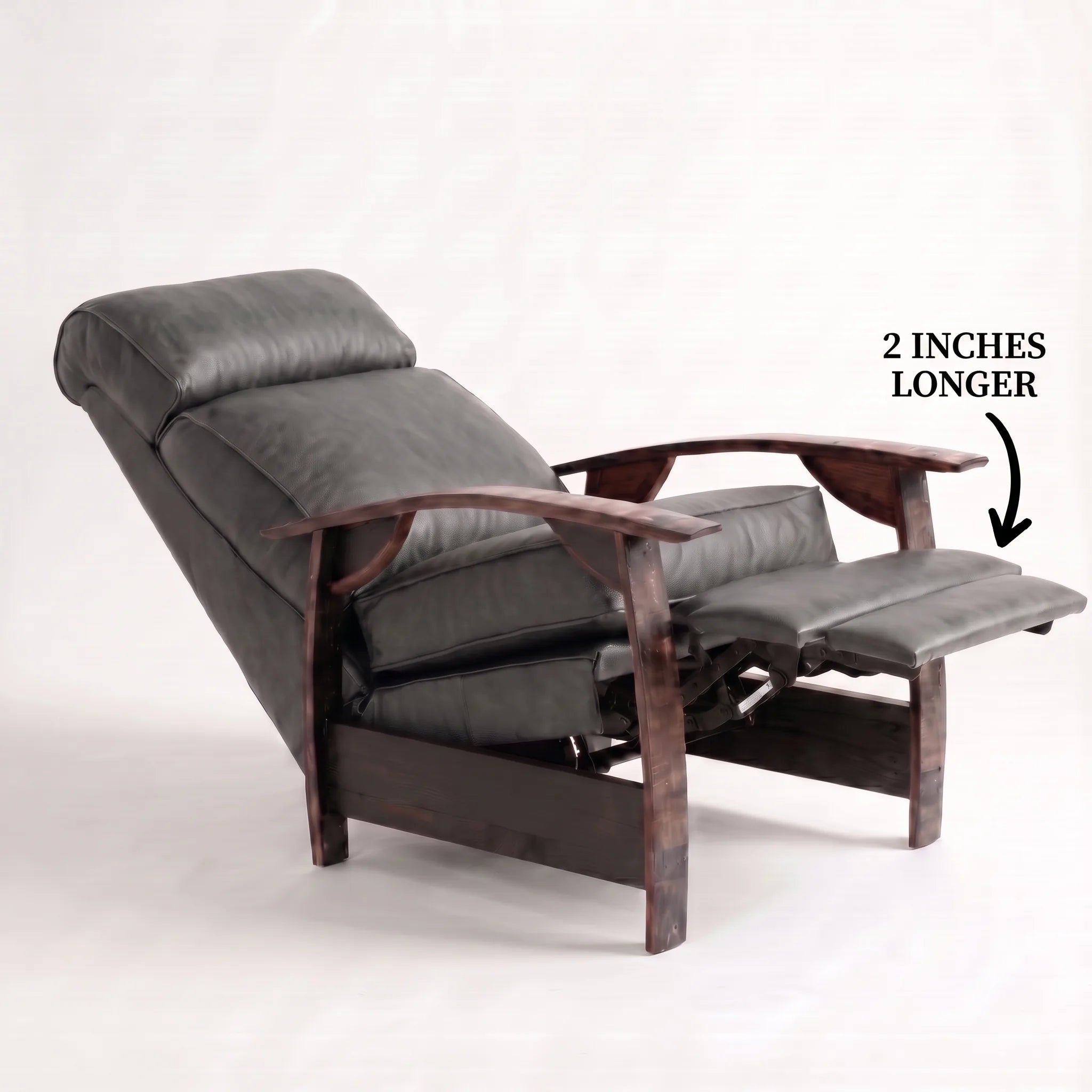 Big & Tall slate gray leather whiskey barrel recliner reclined with the 2-inch-longer footrest extended and oak whiskey-barrel stave armrests, on a white background