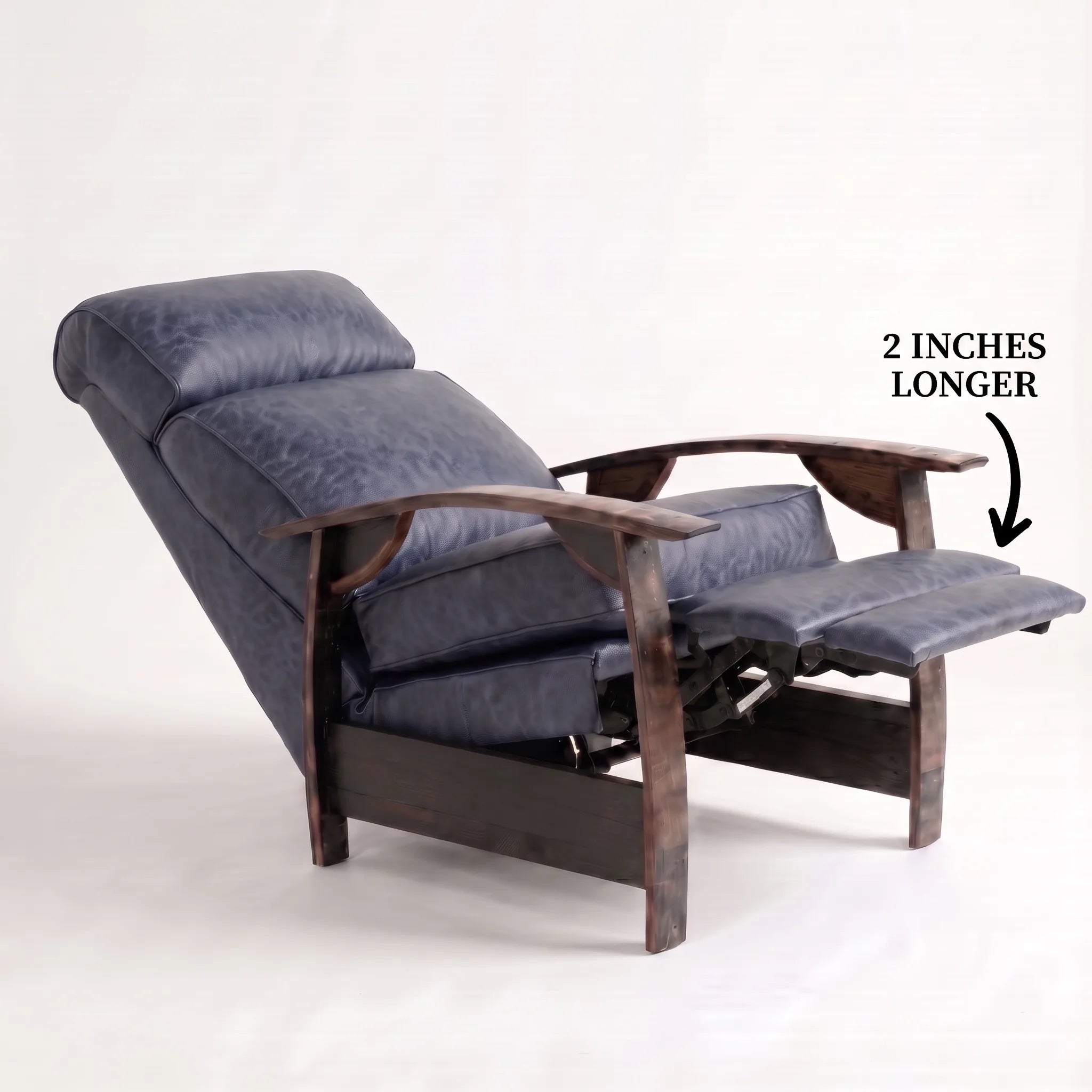 Big & Tall denim blue leather whiskey barrel recliner reclined with the 2-inch-longer footrest extended and oak whiskey-barrel stave armrests, on a white background