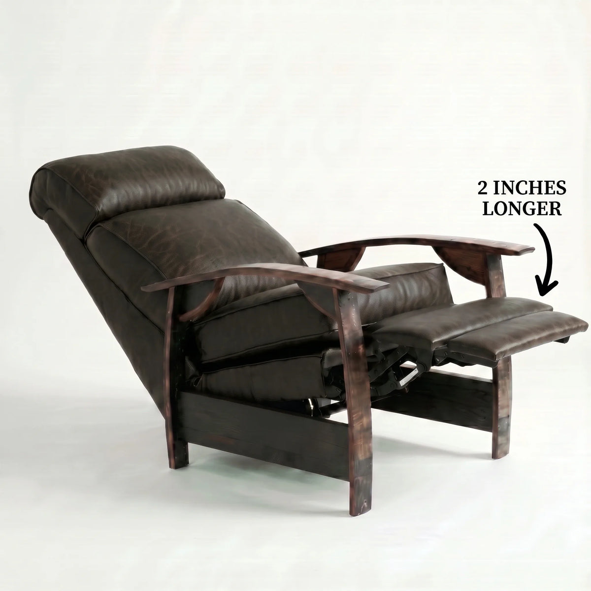 Extra Tall cognac brown leather whiskey barrel recliner reclined with the 2-inch-longer footrest extended and oak whiskey-barrel stave armrests, on a white background