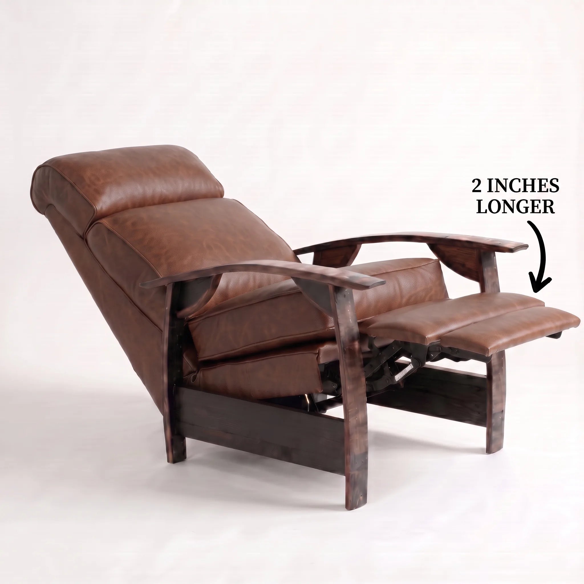 Big & Tall whiskey-brown leather whiskey barrel recliner reclined with the 2-inch-longer footrest extended and oak whiskey-barrel stave armrests, on a white background