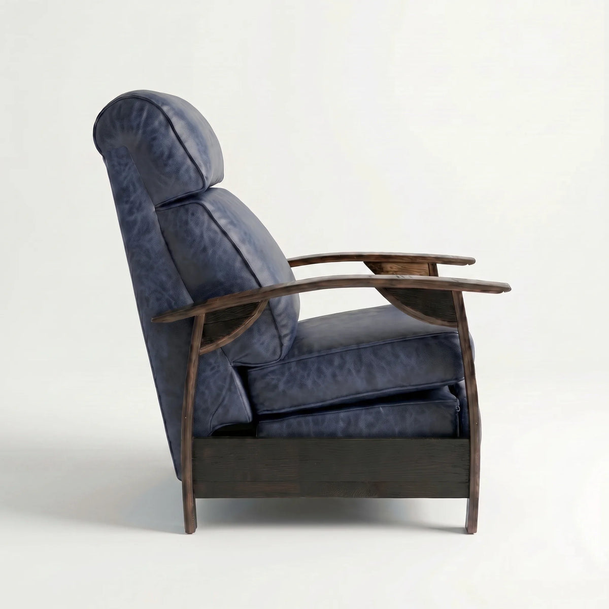 Side profile of the Extra Tall denim blue leather whiskey barrel recliner, upright and closed, on a white background