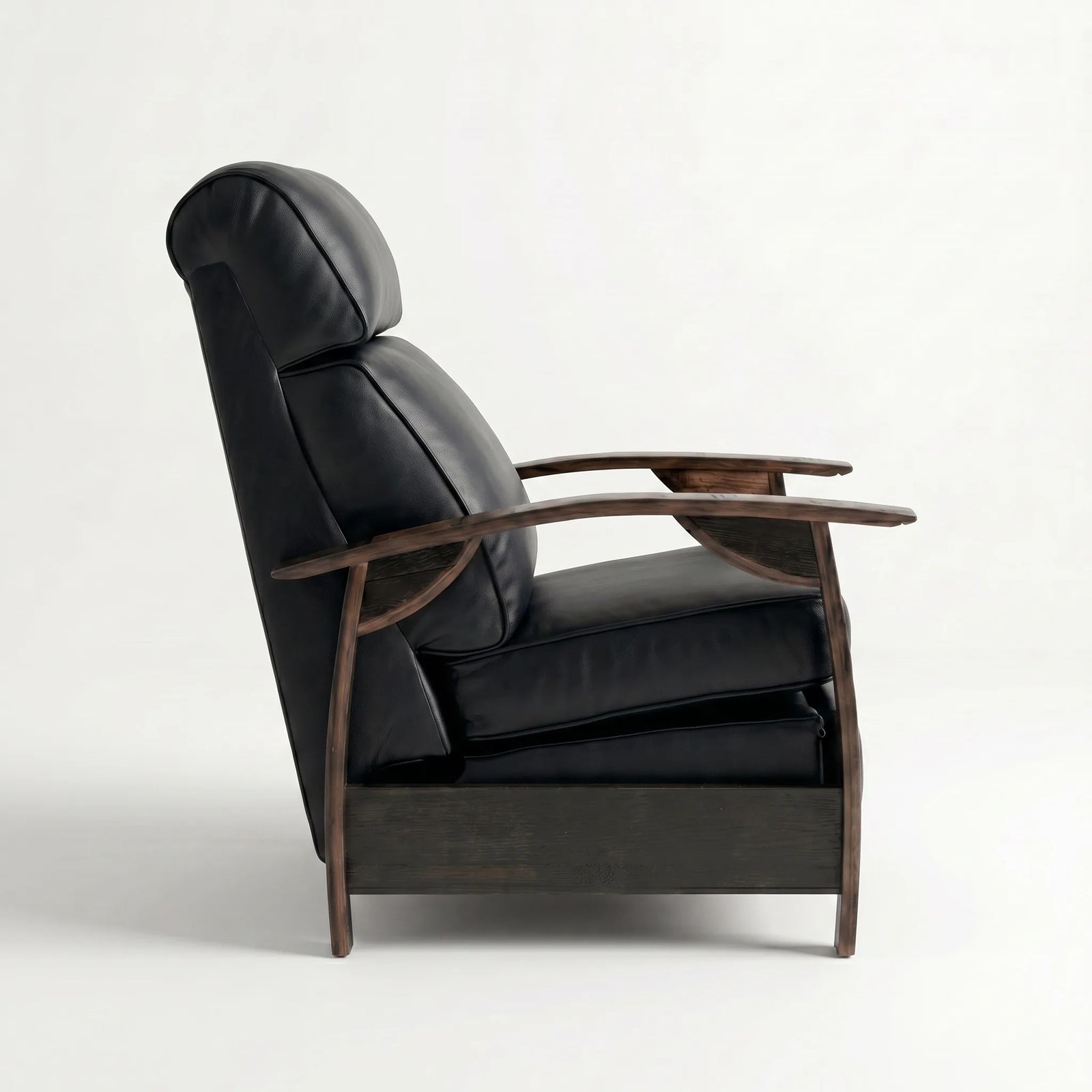 Side profile of the black leather whiskey barrel recliner, upright and closed, on a white background