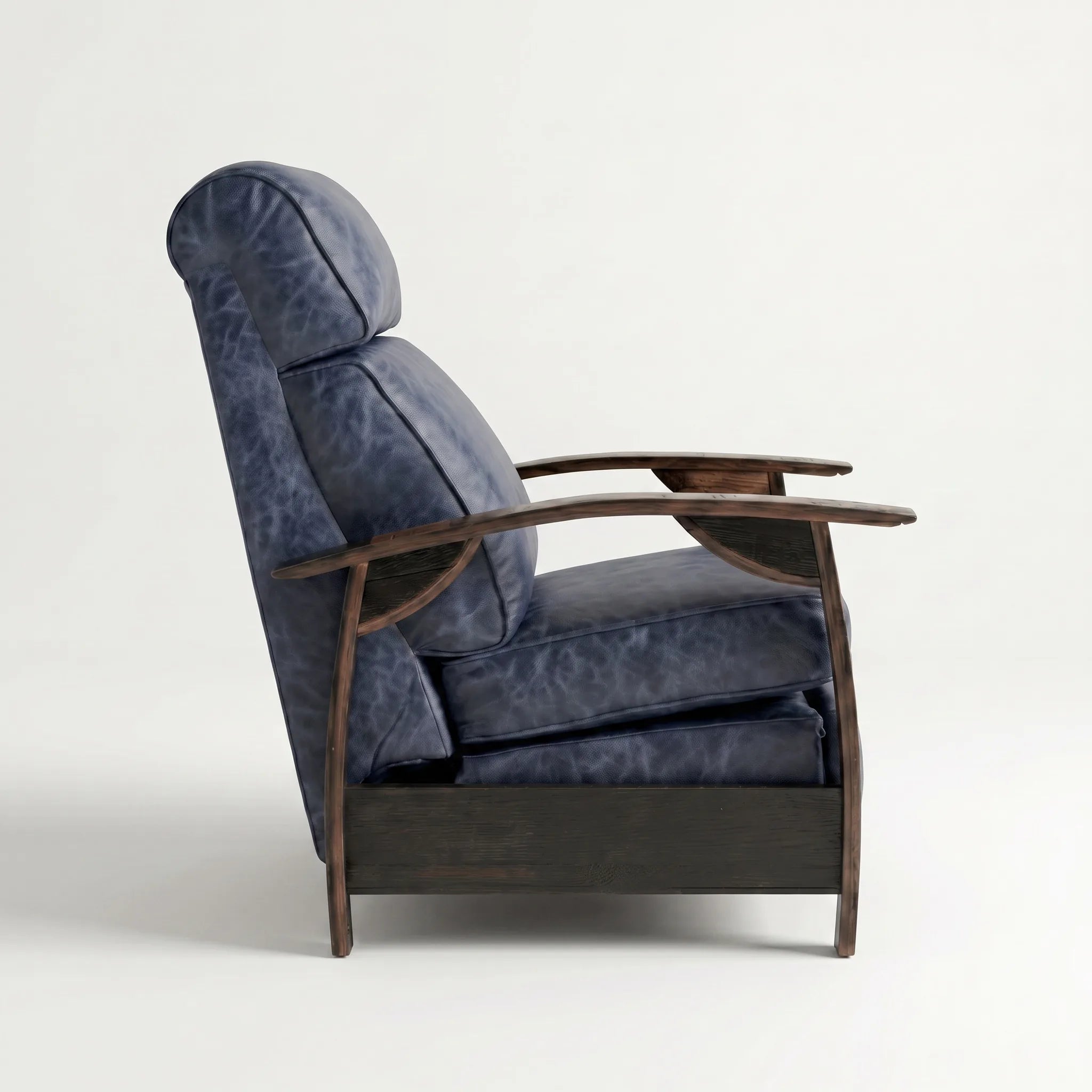 Side profile of the denim blue leather whiskey barrel recliner, upright and closed, on a white background