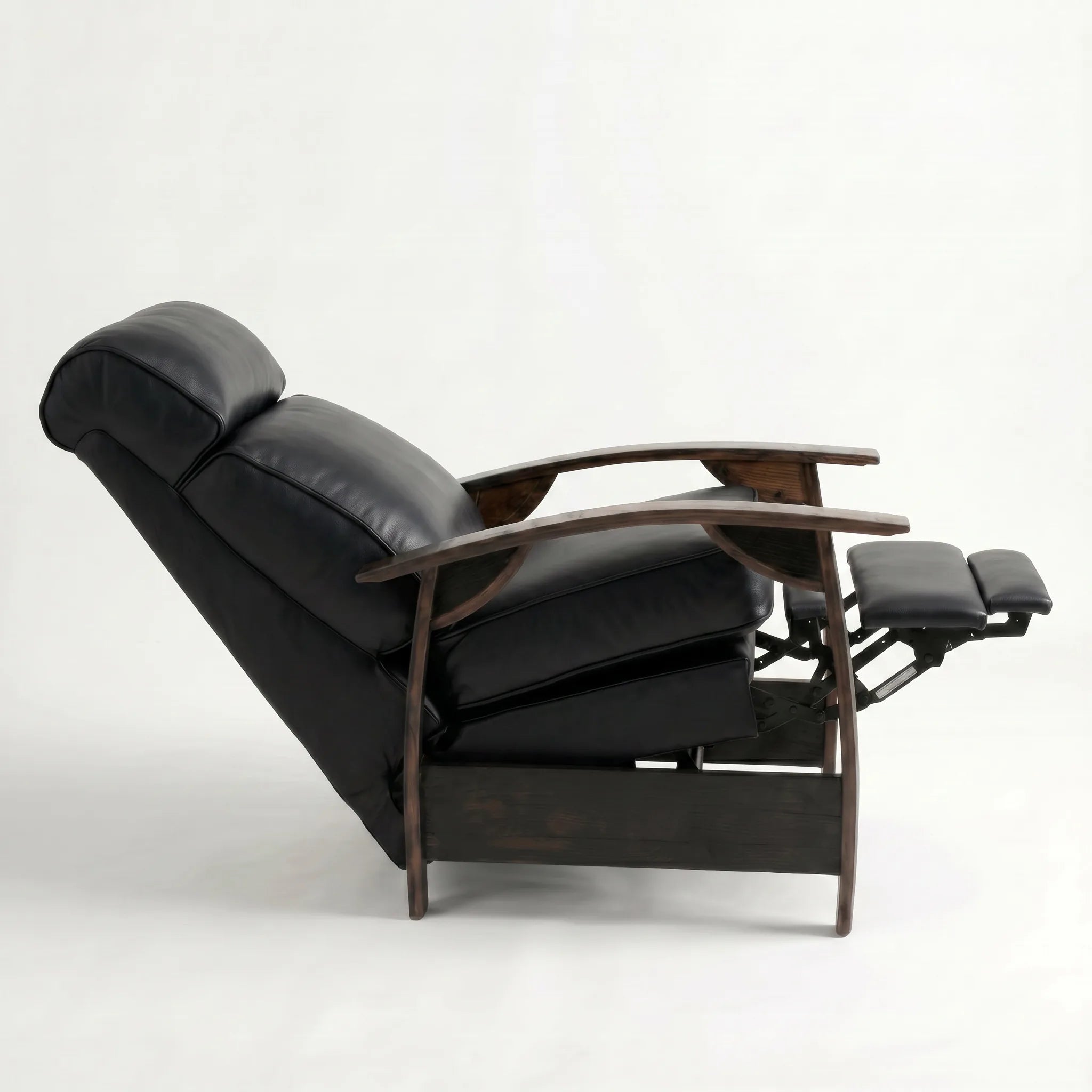 Side view of the black leather whiskey barrel recliner fully reclined, on a white background