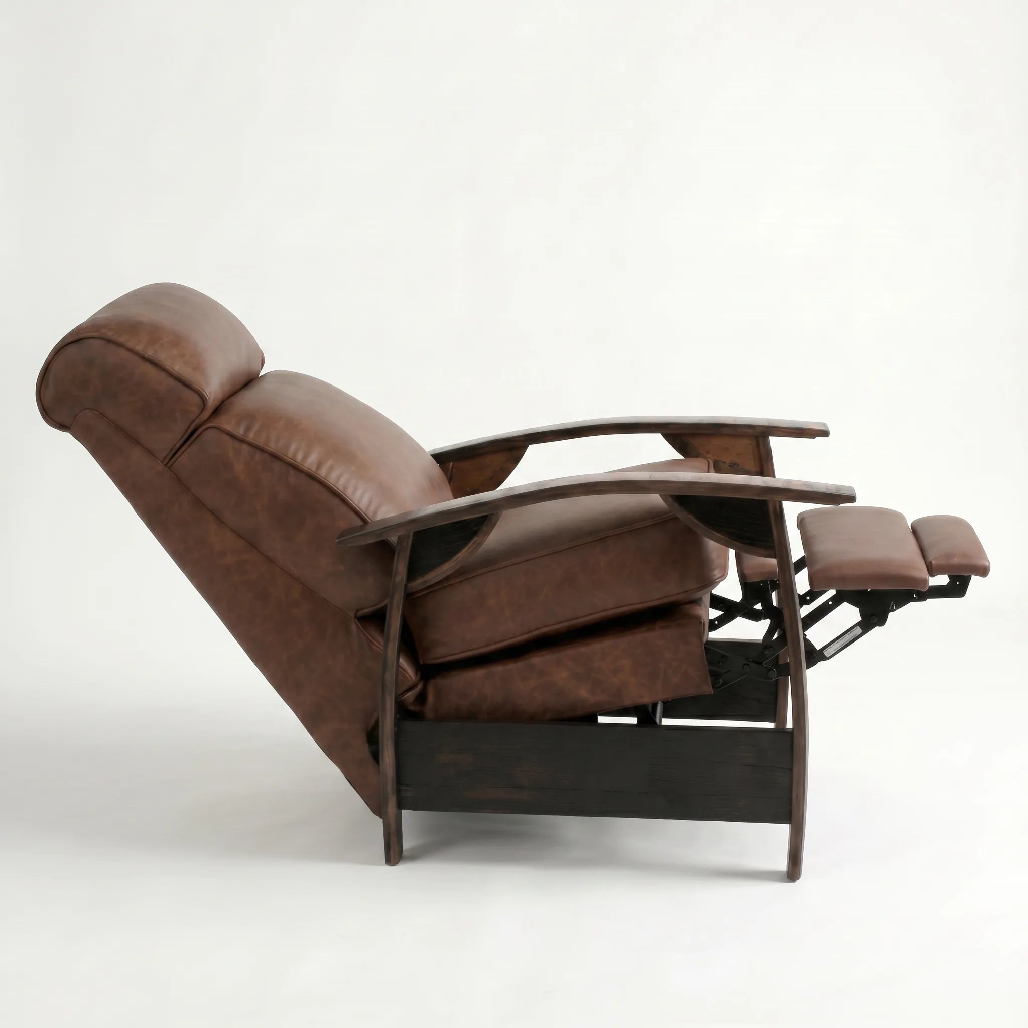 Side view of the whiskey-brown leather whiskey barrel recliner fully reclined, on a white background