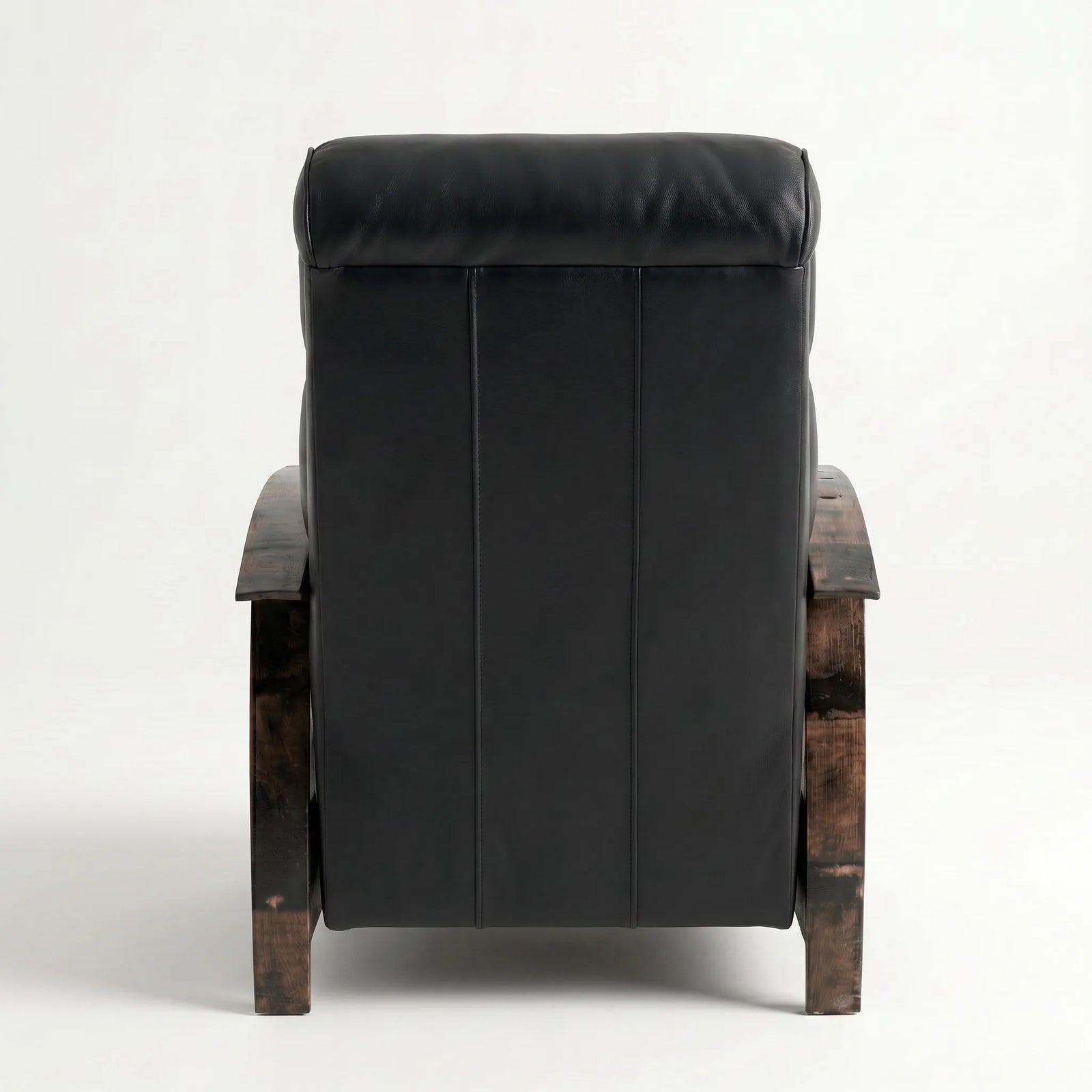 Rear view of the black leather whiskey barrel recliner showing the back panel, on a white background