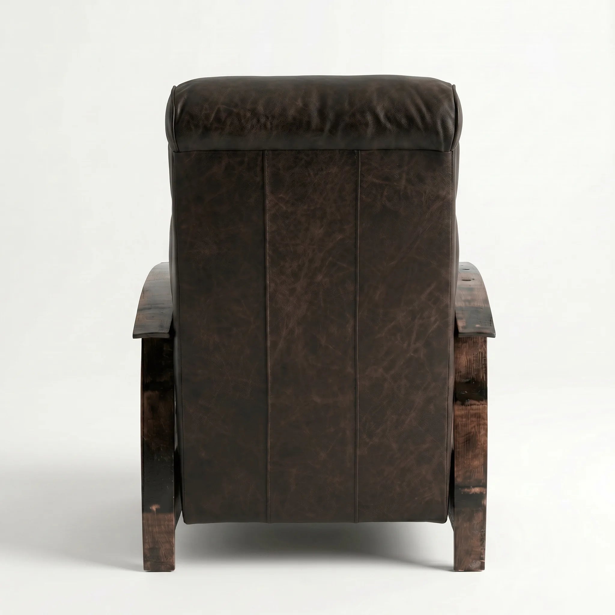 Rear view of the cognac brown leather whiskey barrel recliner showing the back panel, on a white background