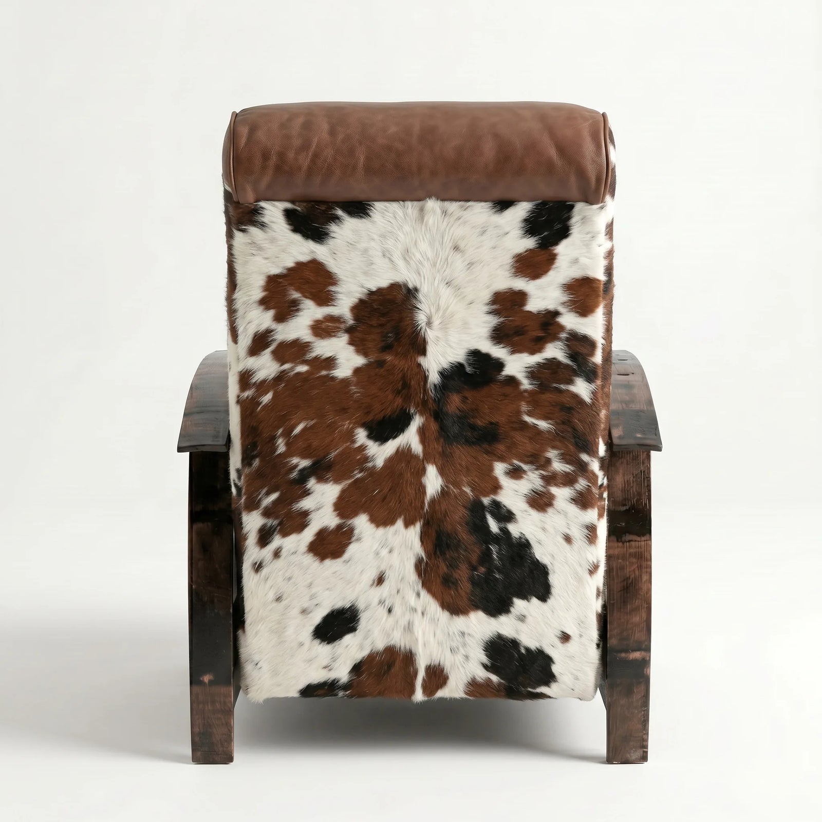 Rear view of the tri-color cowhide whiskey barrel recliner showing the back panel, on a white background