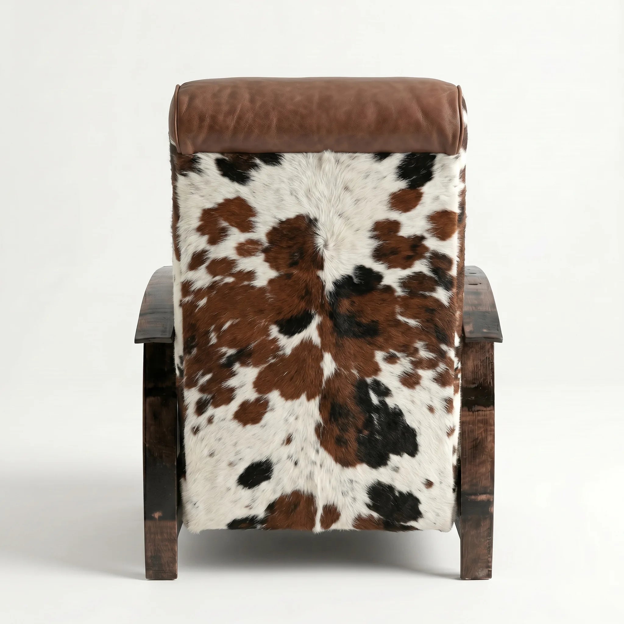 Rear view of the tri-color cowhide whiskey barrel recliner showing the back panel, on a white background