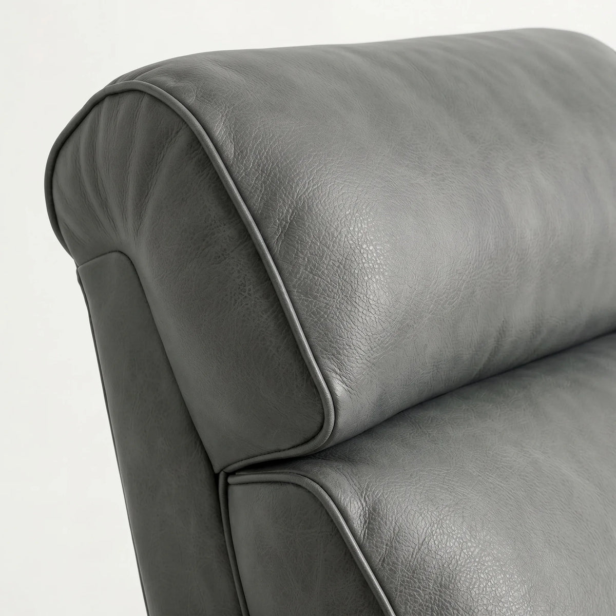Close-up of the Extra Tall slate gray leather whiskey barrel recliner headrest and cushion, on a white background