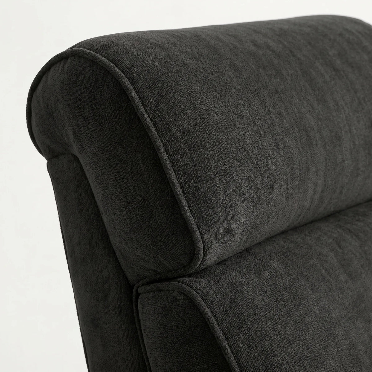 Close-up of the black plush fabric whiskey barrel recliner headrest and cushion, on a white background