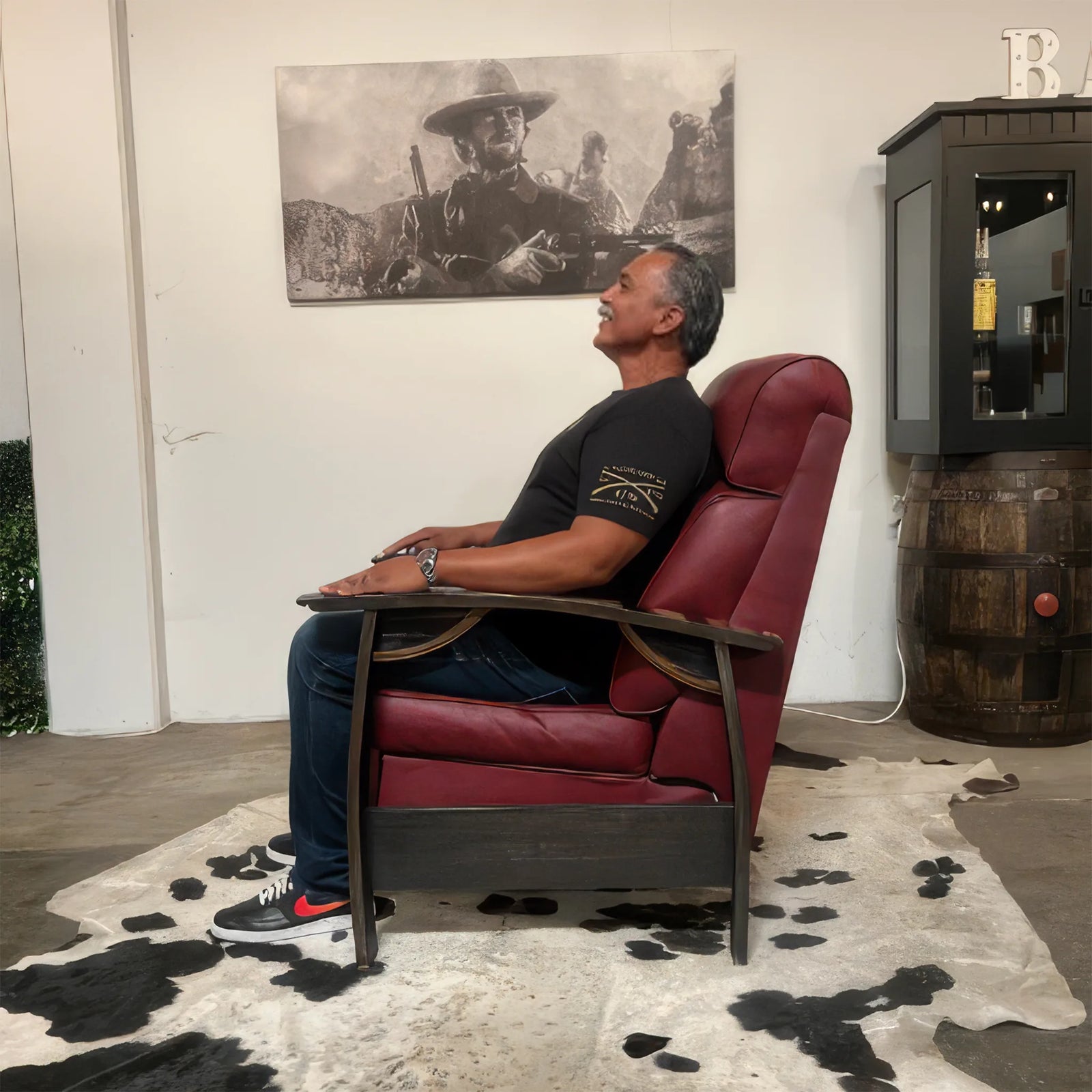 Side profile of a 6'5" man reclining in the Big & Tall Whiskey Barrel Recliner, showing the extra legroom and taller back