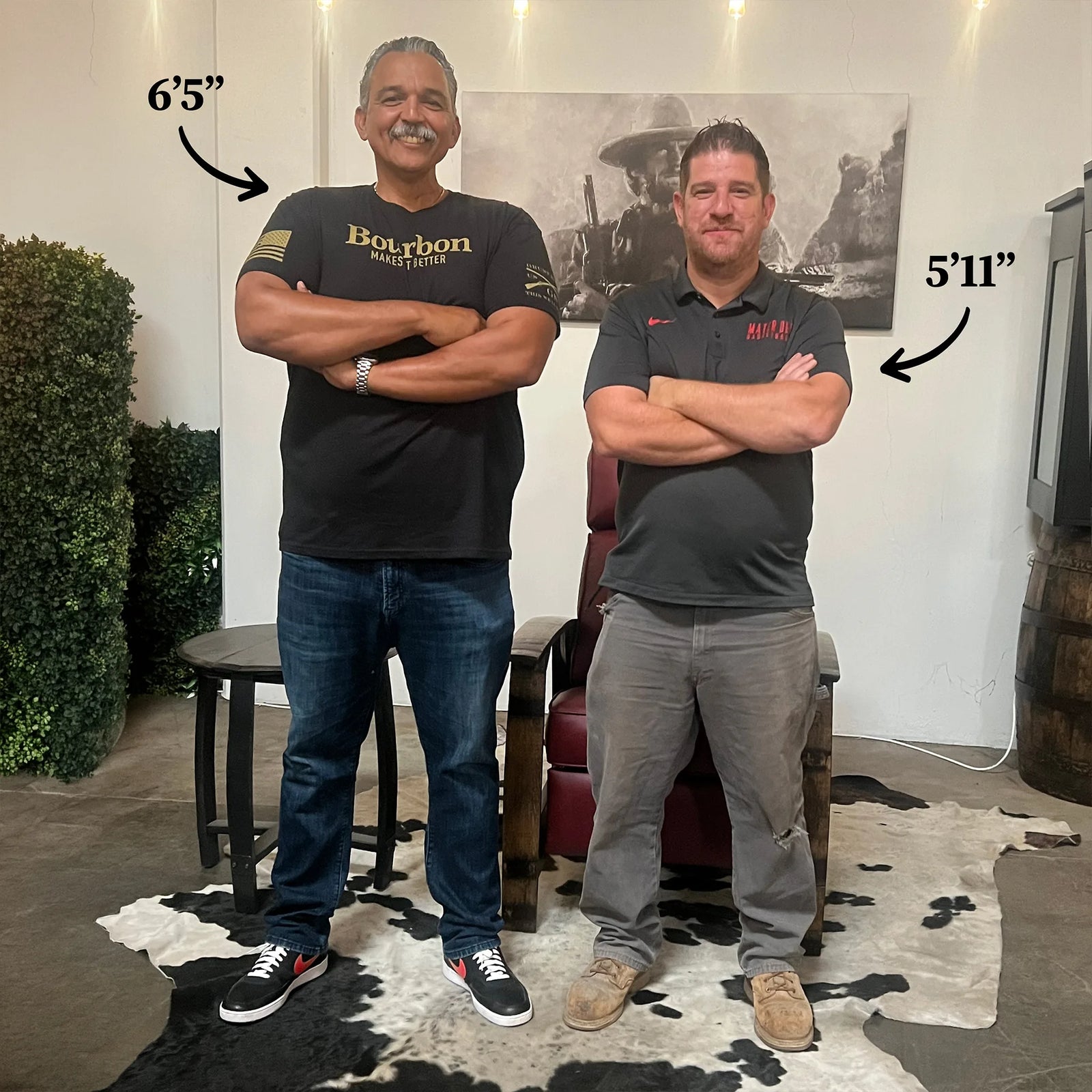 Two men, 6'5" and 5'11", standing beside the Big & Tall and standard Whiskey Barrel Recliners to show the size difference